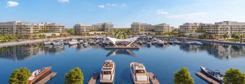 Ramhan Marina waterfront rendering with luxury yachts, modern residences, and sail-shaped pavilion on the inner channel