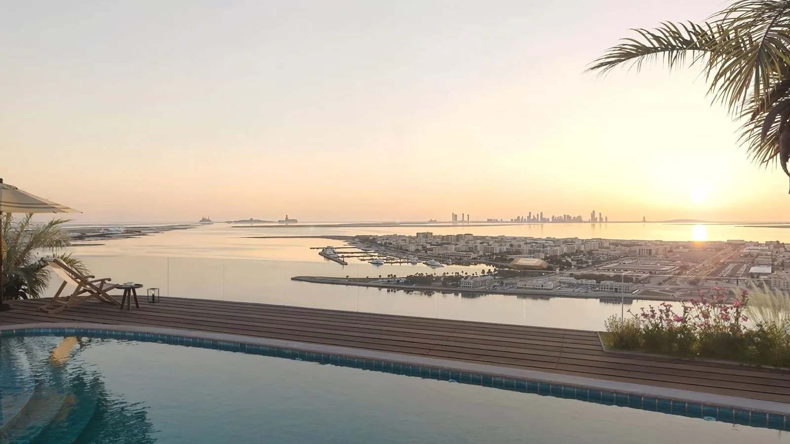 Rooftop pool at The Wadi on the Yas Canal in Abu Dhabi, looking toward the waterfront and distant skyline