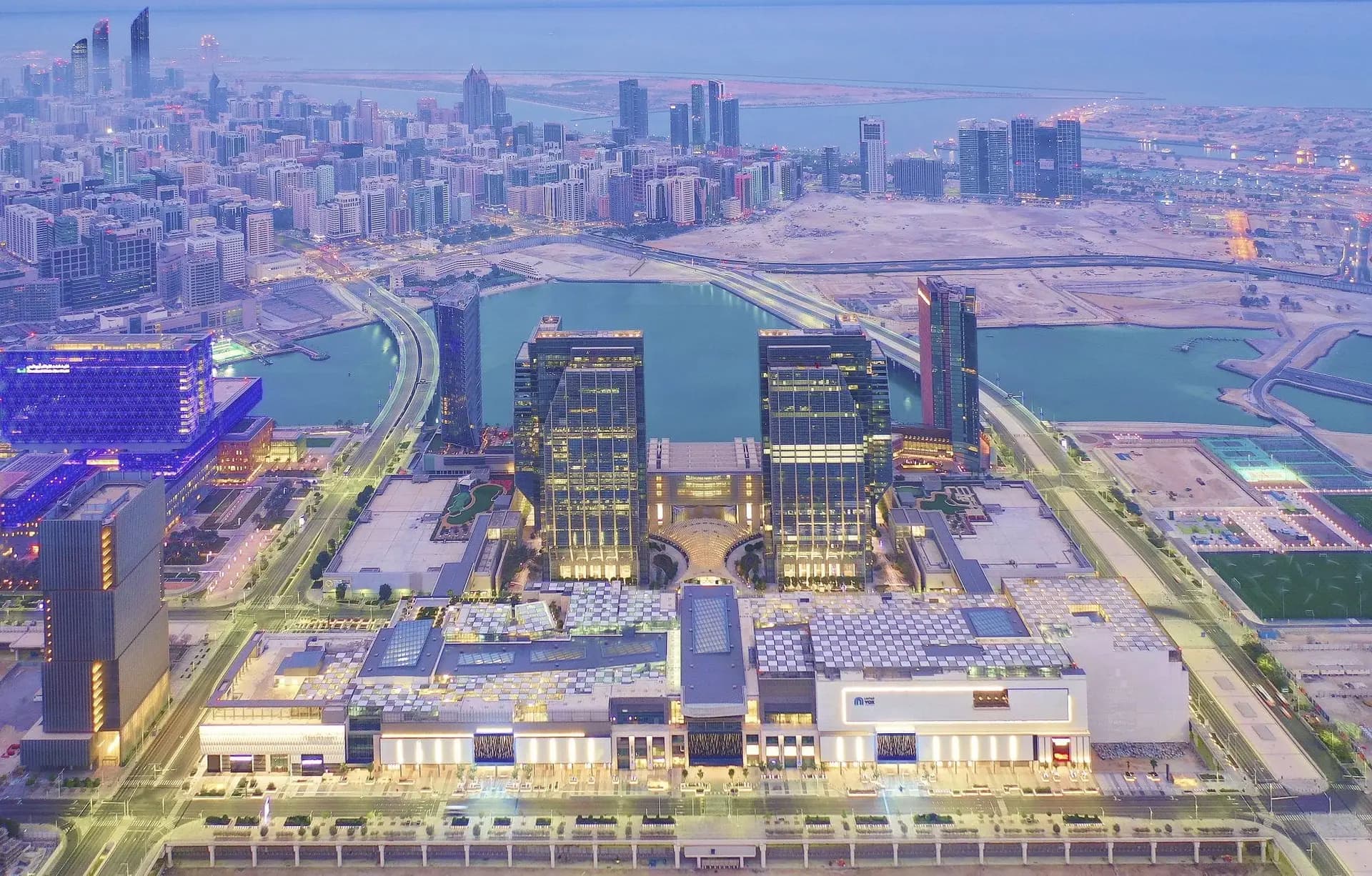 Address Residences Al Maryah Island, Al Maryah Island, Abu Dhabi: The Galleria and Abu Dhabi Global Market towers at dusk.