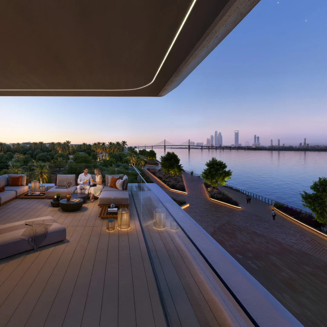 Waterfront terrace lounge at Bashayer Residences overlooking Hudayriyat Island and Abu Dhabi skyline at dusk