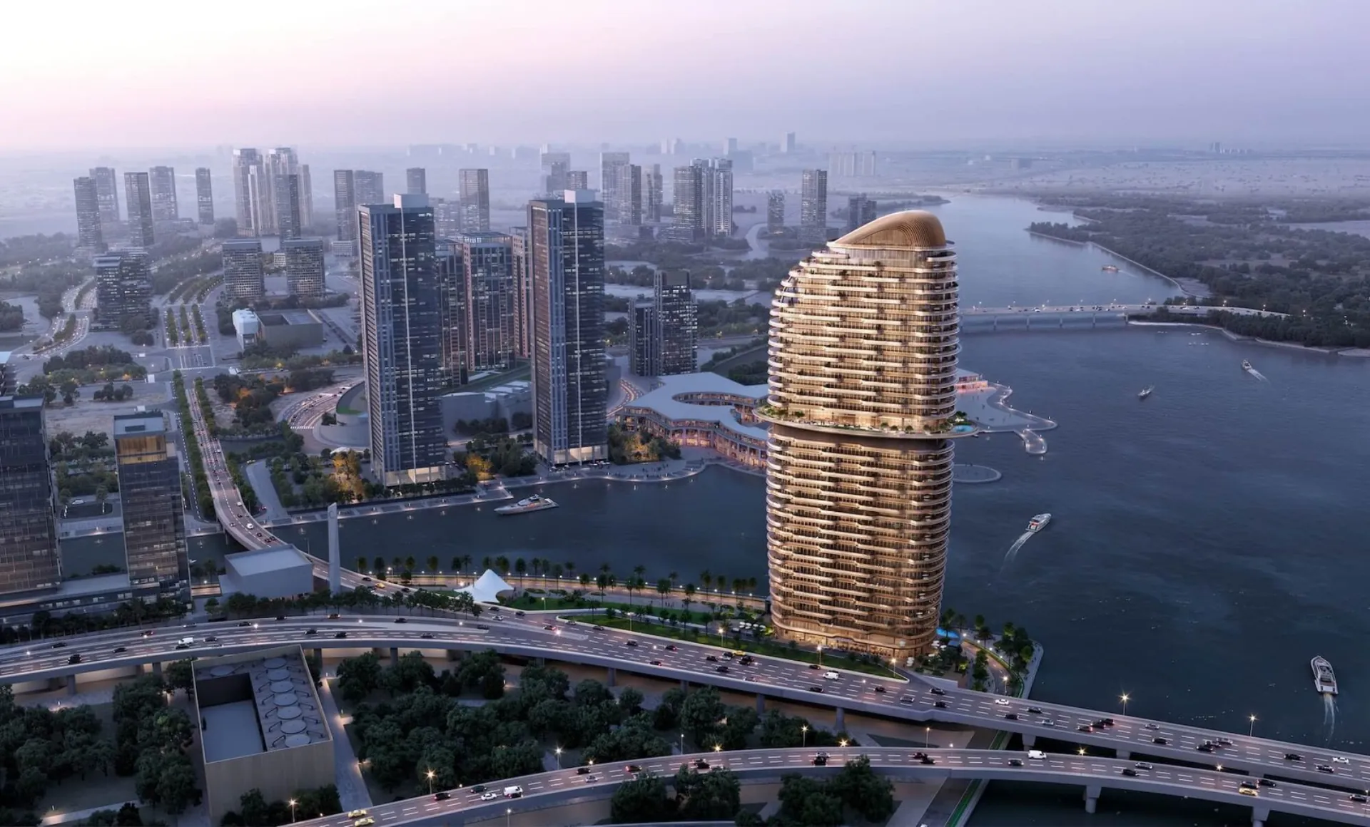 Dusk aerial of Jumeirah Residences at Al Maryah Island, Abu Dhabi, beside the waterfront causeway