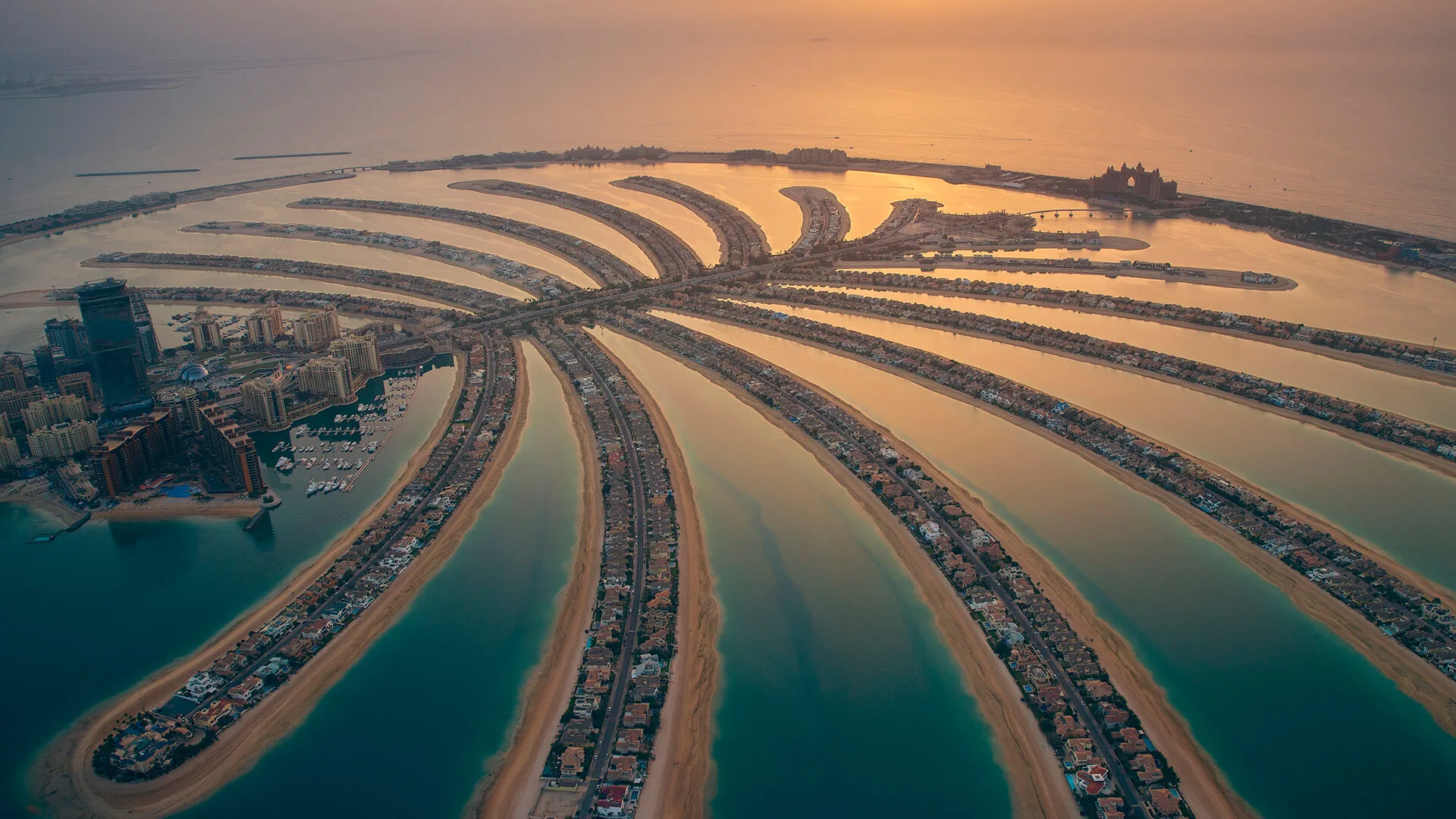 Palm Springs by Nakheel, developer Nakheel, Dubai: aerial of Palm Jumeirah fronds at sunset. This photograph shows Palm Jumeirah, not the Palm Springs community.
