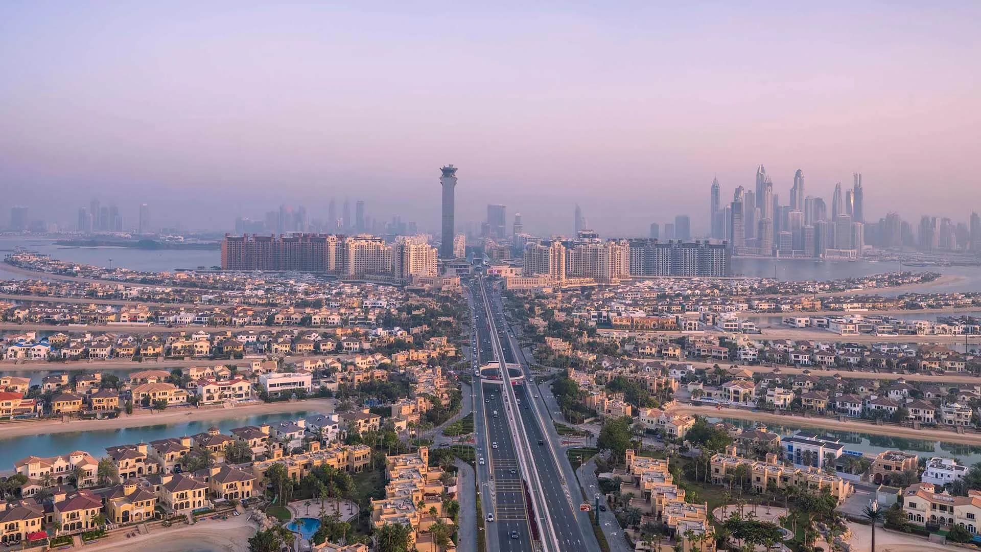 Palm Springs by Nakheel, developer Nakheel, Dubai: Palm Jumeirah trunk and Dubai skyline. This photograph shows Palm Jumeirah, not the Palm Springs community.
