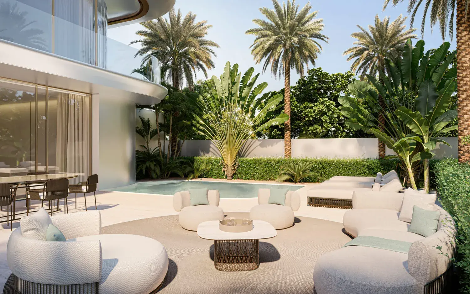 Landscaped residents courtyard at Stellar by Elie Saab with palm trees and outdoor lounge seating on Yas Island